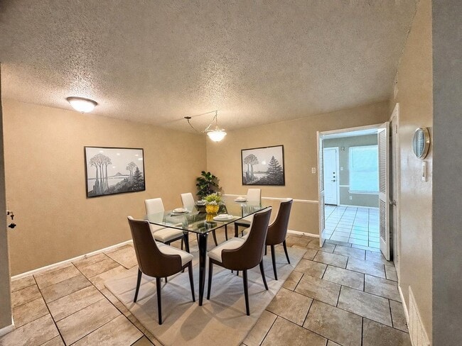 Photo - Single-level living on ground floor  |  Fresh paint (July 2026)  |  2 carports  |  Community Pool...