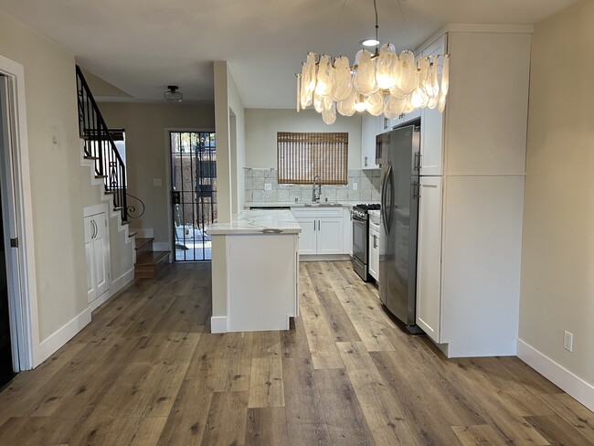 Kitchen and entryway - 1890 S Cochran Ave Unit 1890 S Cochran Ave Apt 13
