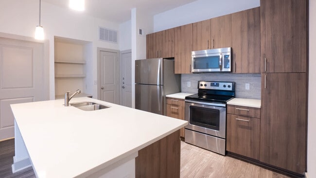 Kitchen with Breakfast Bar and Stainless Steel Appliances