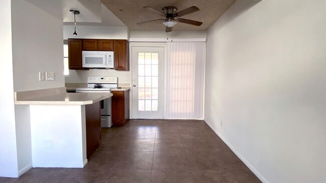 Photo - Great 3 bedroom and 1.5 bath townhouse with a small yard and 2 car garage.