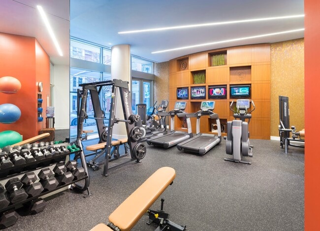 Fully-equipped fitness room with Pelotons