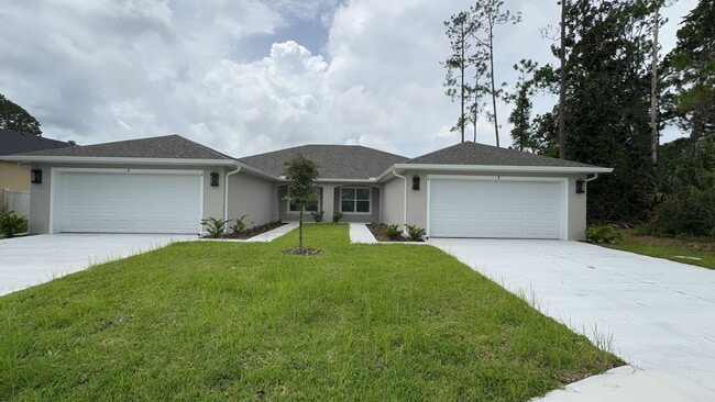 Building Photo - BRAND NEW FENCED Beautiful 4-bedroom, 3-bathroom Duplex in Double LL section of Palm Coast