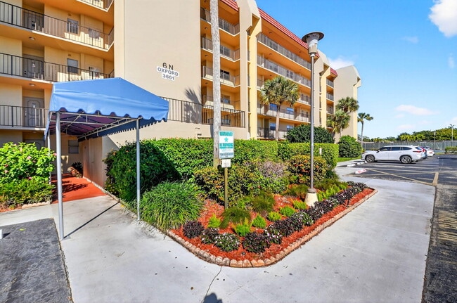 Building Photo - 3661 Via Poinciana Unit 410