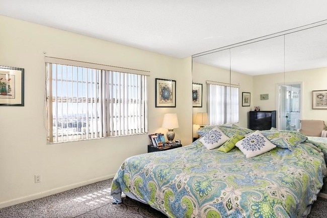 Master bedroom with ocean view from window. - 1500 S Ocean Blvd Unit 1505