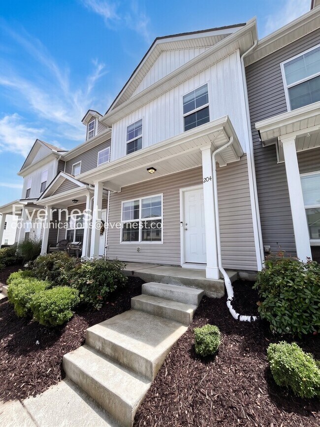 Photo - 2-Bed/3-Bath Townhouse with Modern Amenities/ Pet-Friendly /Available Now!