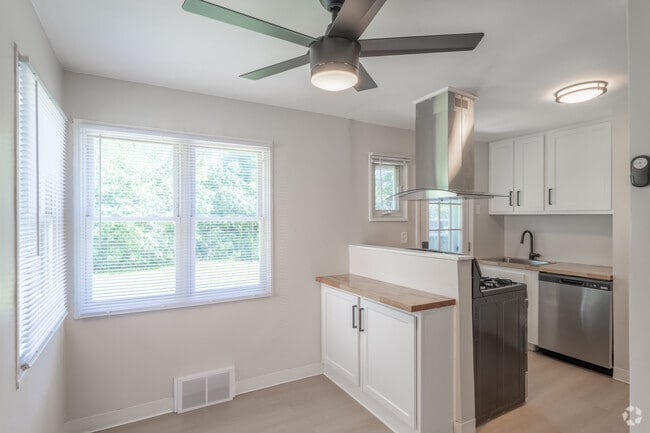 2BR, 1BA - 815SF - Dining Area and Kitchen - Amherst Townhomes