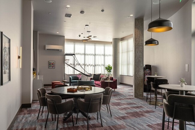 East Building Music Room featuring a karaoke machine, poker table, and various games - AMLI Redmond Way