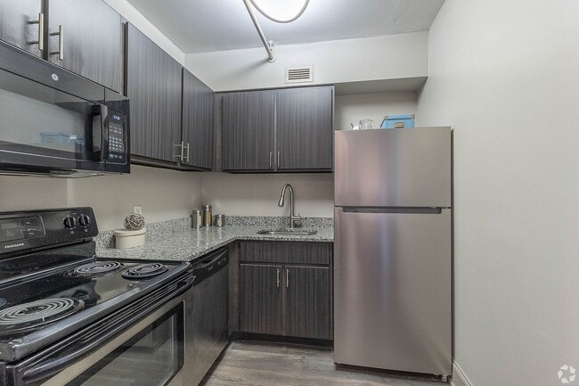 Kitchen with granite counters and stainless appliances
