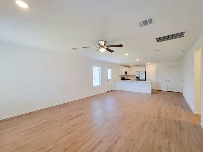 Photo - This single-story home has a comfortable layout with three bedrooms and a living area all on one ...