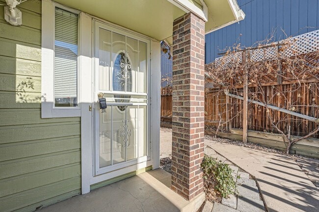 Photo - Spacious 2-Bed Townhome with Private Yard & 2-Car Garage in Aurora