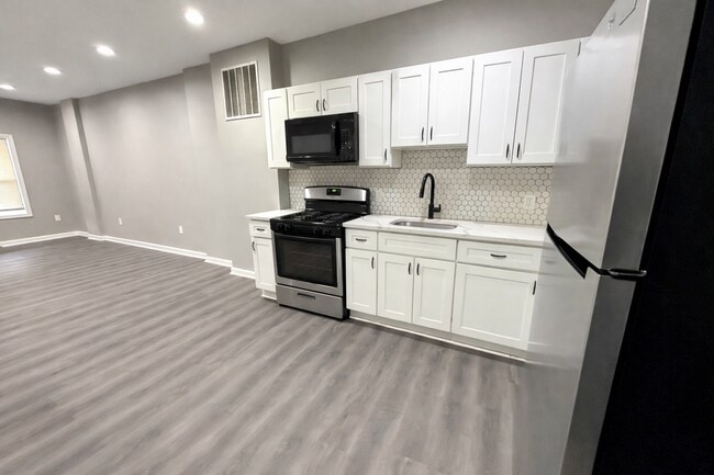 Photo - Beautiful 2BR + Den Home with 2 Baths, Modern Kitchen & Central AC