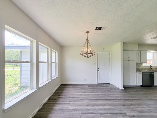 Photo - This fully renovated 3-bedroom, 2-bath home features a modern kitchen, large master suite with a ...