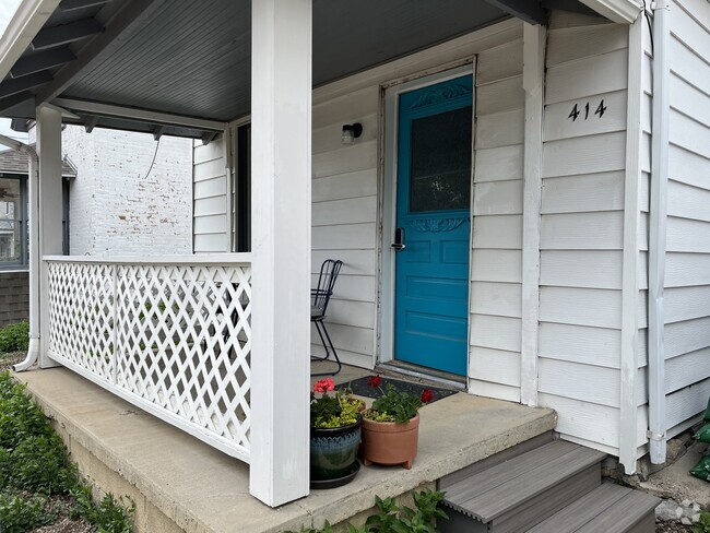 The front porch is perfect for a morning cup of coffee. - 414 S Commercial St Rental