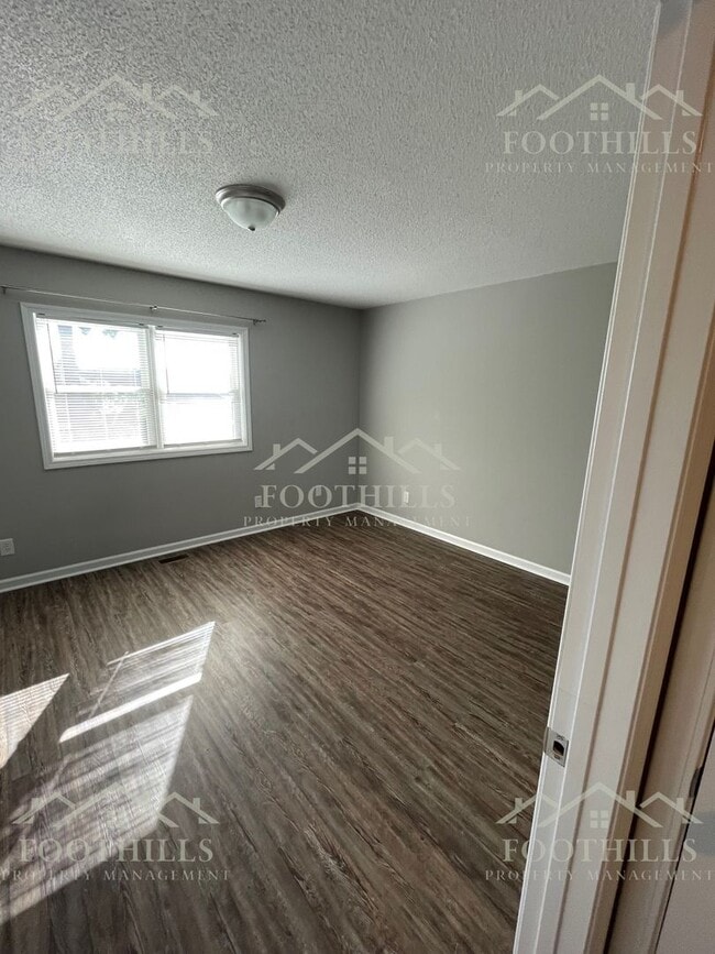 Photo - 2-Bedroom Home with Fenced Backyard and Ap...