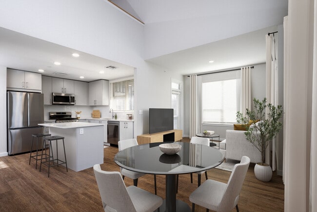 Kitchen, dining, and living room with hard surface flooring