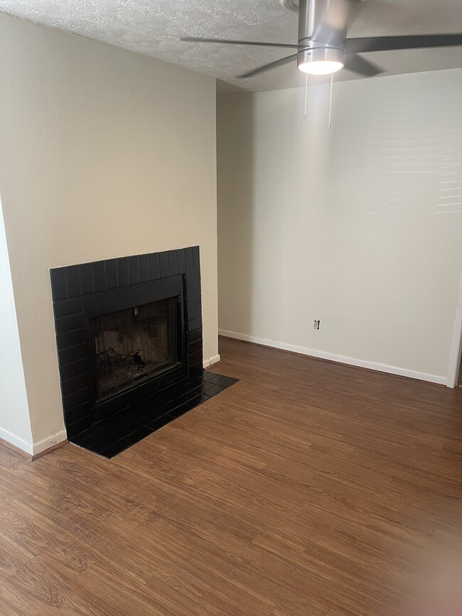 Living room with fireplace - 4441 Old College Rd Unit #4201