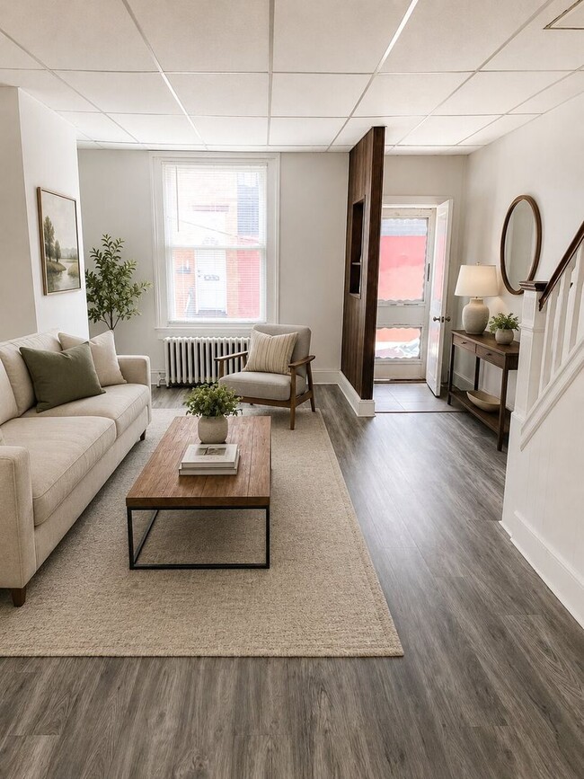 Building Photo - Bright 2BR Port Richmond Row Home with Large Living Space & Basement Storage