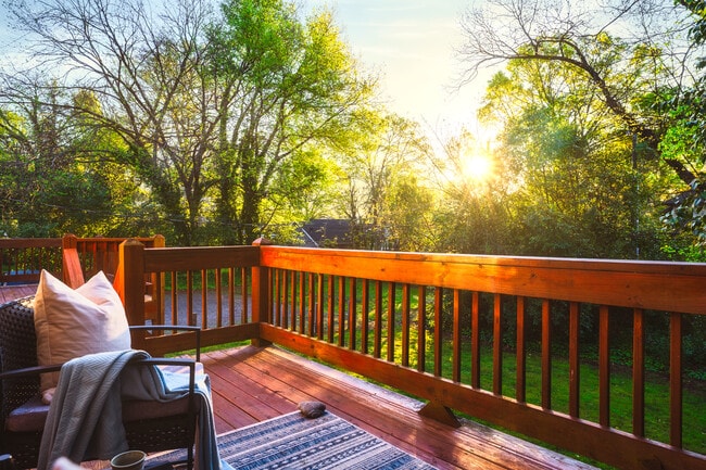 Enjoy breathtaking views and peaceful mornings on this private balcony, surrounded by lush greenery
