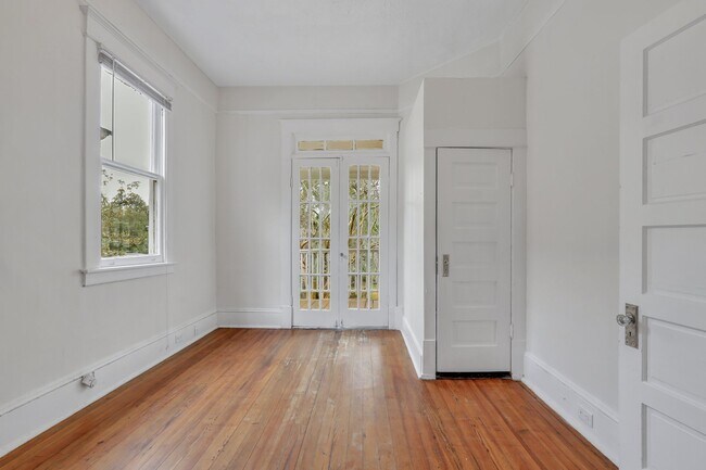 Front Bedroom with French Doors leading out onto deck/porch - 1120 E 31st St Apartments Unit B