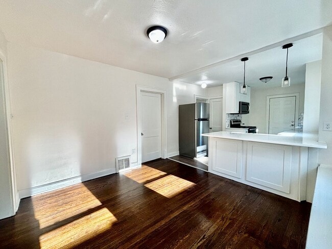 Photo - Fully Renovated 2-Bedroom Home with Back Deck, Basement & Off-Street Parking