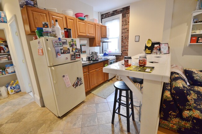 kitchen with an island - Peterborough Apartments