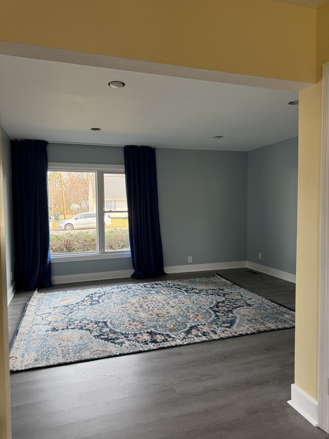 Big living room with blackout drapes - 403 John St Unit Apartment