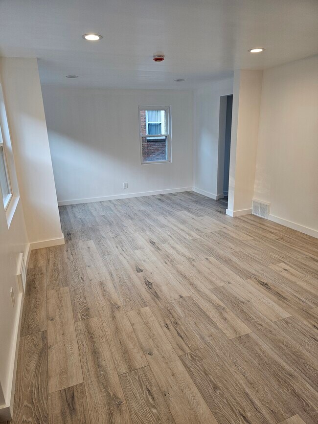 open concept living room and dining room - 4355 Coleridge St Unit 1st floor