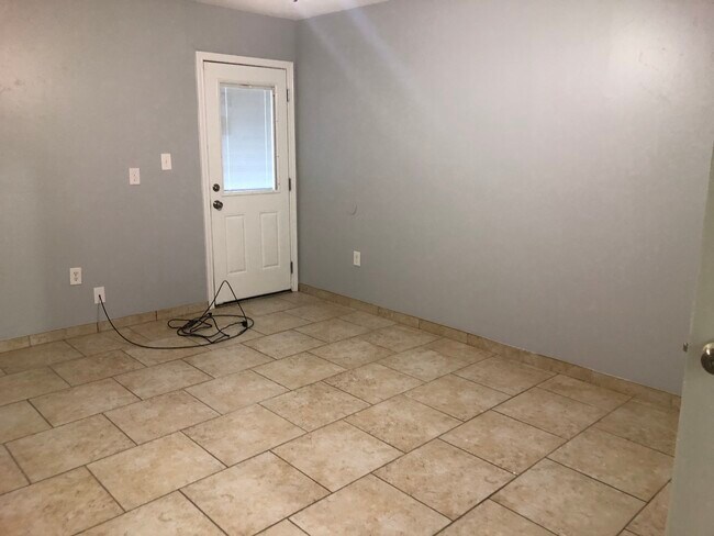 Bedroom 1 with door to patio - 225 Orr St House