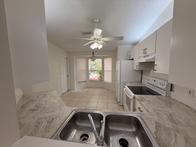 Photo - Centrally located 3/2 with 2 car garage. Pet friendly with fenced in backyard. Lawncare included.