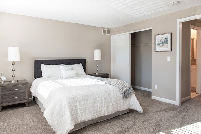 Master bedroom with view of large closet