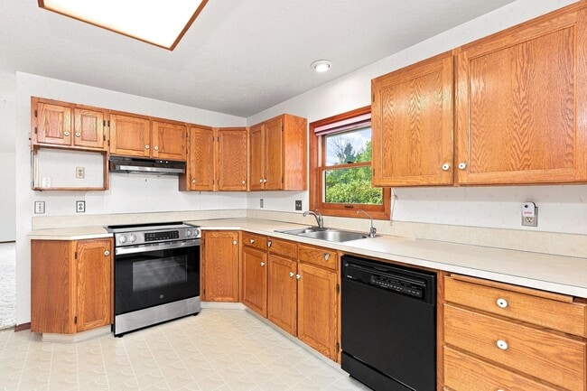 Photo - Charming 3-Bedroom Home with Garage & Lawn Care Included
