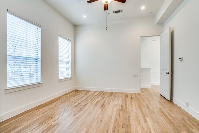 Photo - Beautiful townhome featuring granite countertops, hard wood floors, and a small private yard grea...