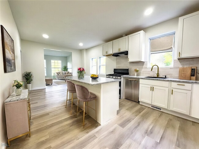 Virtually Staged Kitchen - 2483 E 89th St Unit 101