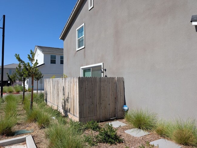 Photo - Modern home in a modern community featuring upgraded amities, solar, community pool + Close to Co...