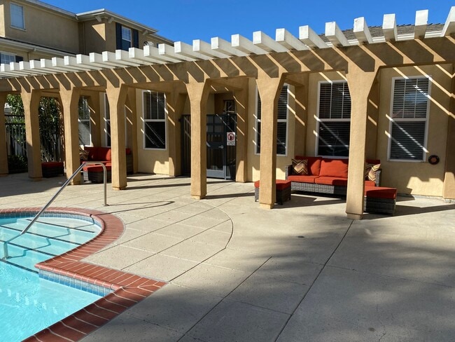 Pool and spa with pergola sitting area