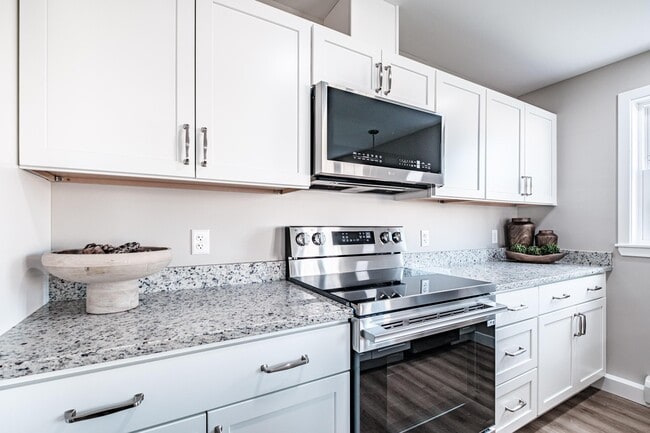 Contemporary kitchen design with premium stainless steel appliances, spacious granite countertops, and ample cabinetry for convenient everyday living.