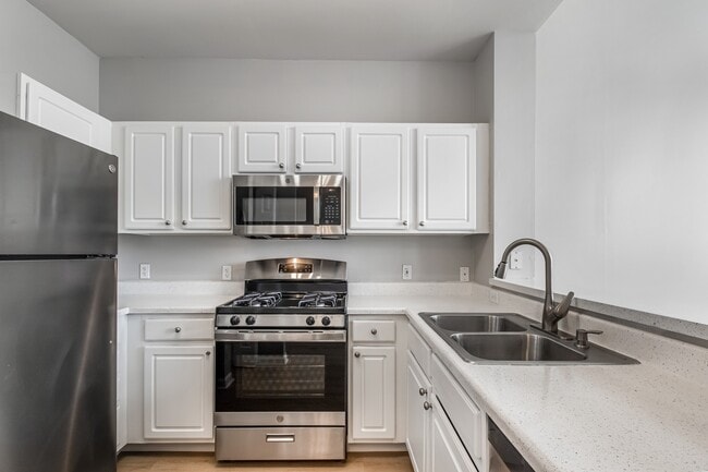 Enjoy a bright, modern kitchen with stylish finishes and plenty of space for everyday living. - Villages At Canterfield