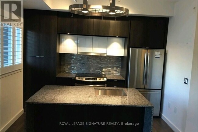 Photo - 5005 Harvard Rd Unité 104