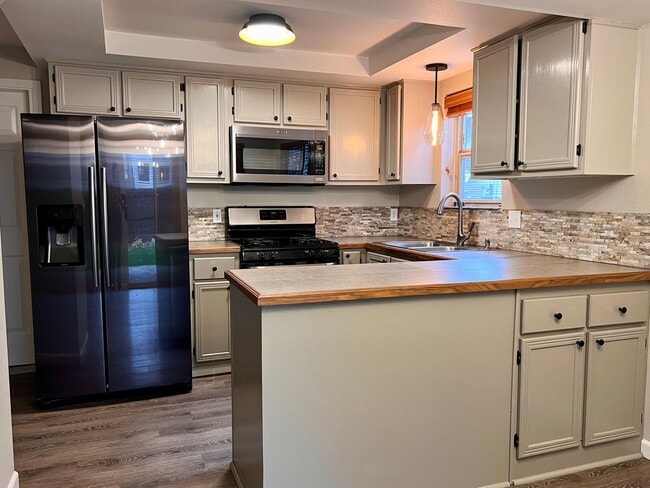 Photo - Water/Sewer/Garbage and landscaping included! A/C too! Unit 11