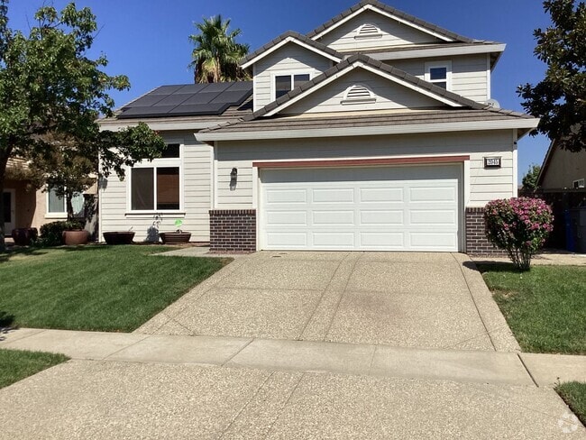 Building Photo - 4 Bedroom 3 bath with solar Rental