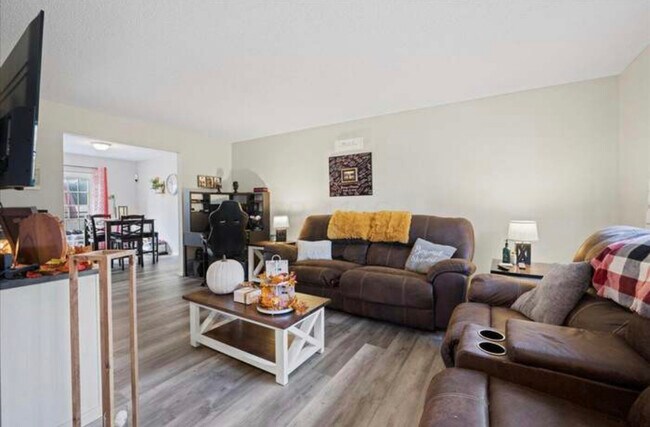 Living room - 6121 Stornoway Dr S Unit Cozy Condo