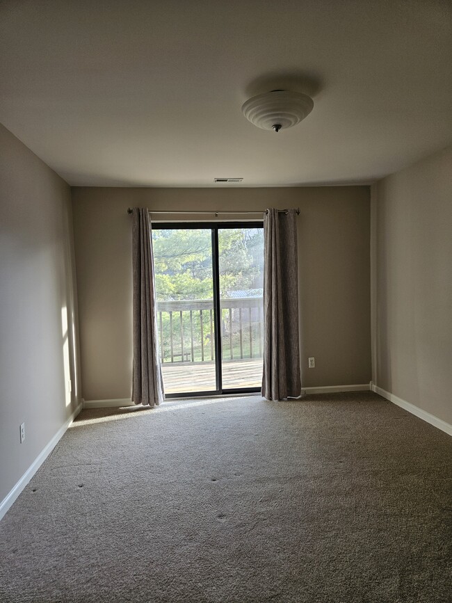 Master bedroom with deck entrance - 895 S Pontiac Trail Condo Unit 304