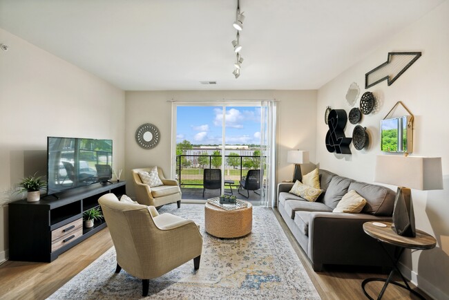 Spacious Living Area - Waterside at River Park Apartments