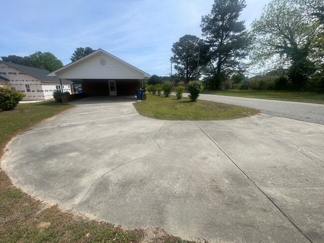 Photo - Brick Ranch- Dunn- 4 bedroom 2.5 bath- 2 car carport- Corner Lot