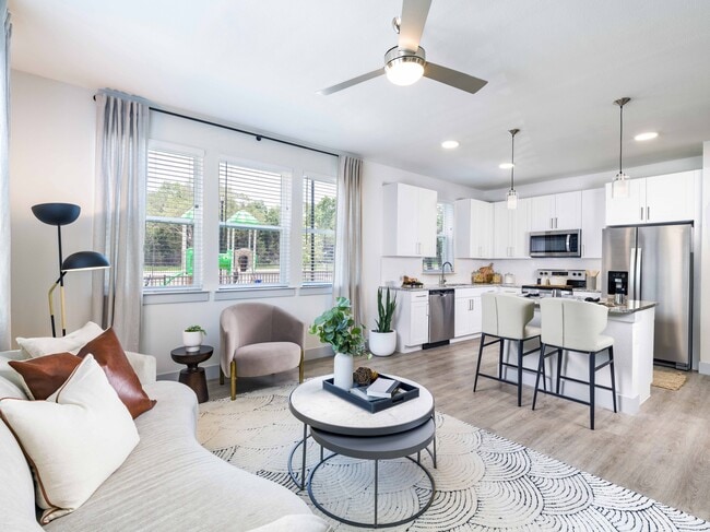 Indulge your culinary passions in style at Modera Georgetown's gourmet kitchen, featuring granite countertops, sleek shaker white cabinetry with satin pulls, and elegant under-cabinet lighting.