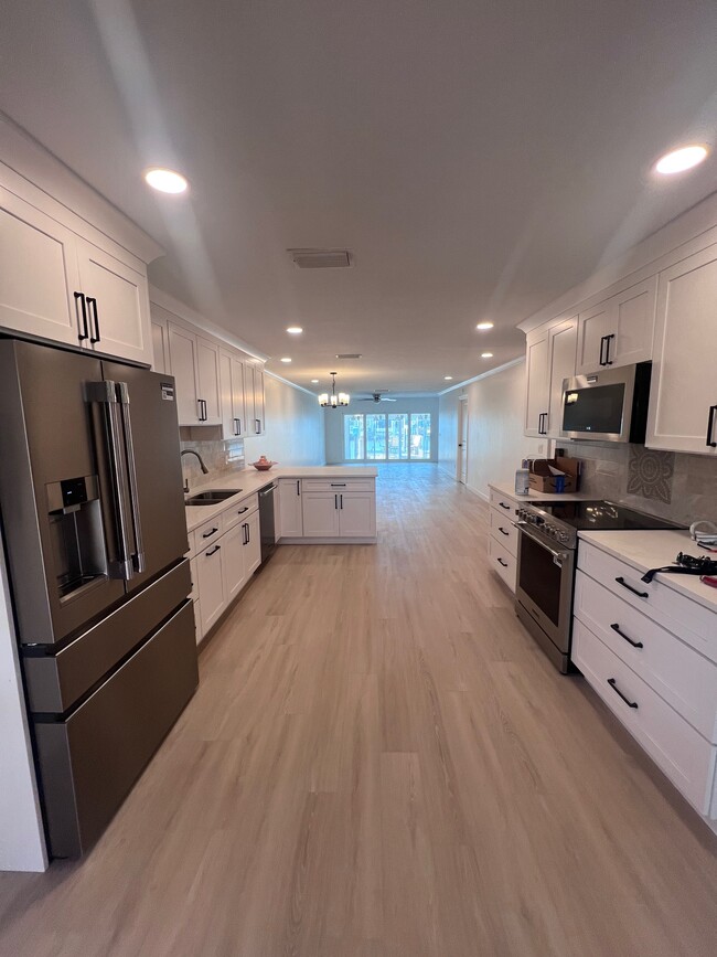 Kitchen view into living room - 282 Boca Ciega Point Blvd N Unit 282 Boca Ciega Pt Blvd N