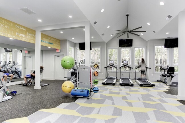 24-Hour Fitness Center with Cardio Machines, Free Weights, and Yoga Area