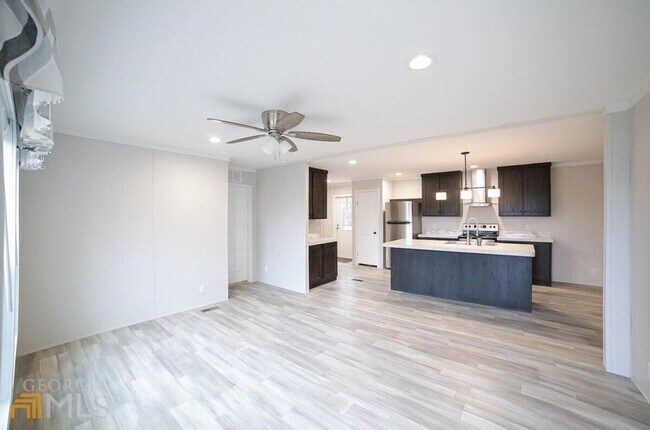 Photo - Spacious 4-Bedroom Home with Lawn Maintena...