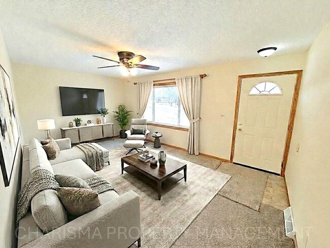 Building Photo - 4 BD, 2 BA - FENCED IN YARD, PRIVATE TRAILS, FINISHED UPPER AND LOWER LIVING AREAS, ATTACHED GARAGE!