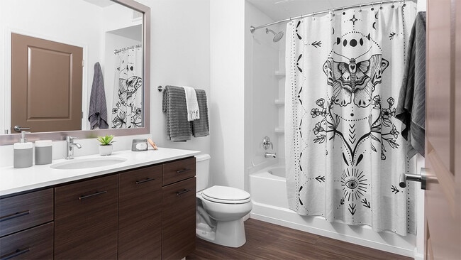Bathroom with Large Soaking Tub and Wood-Style Flooring.